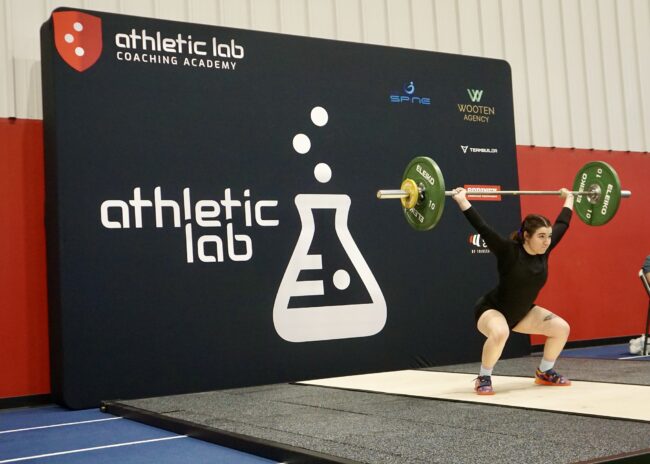 Athletic Lab 2024 Spring Open woman lifting a barbell above her head